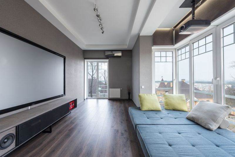Living room with a large screen and sound system
