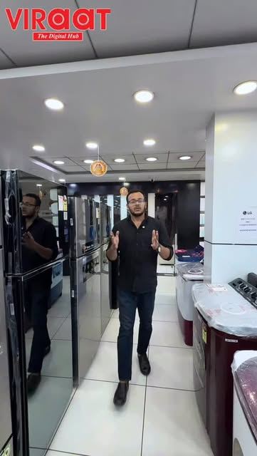Showroom aisle lined with refrigerators