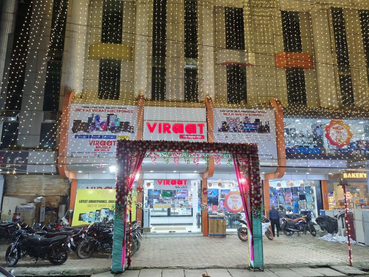 Viraat The Digital Hub storefront decorated with lights and a flower arch for the festival